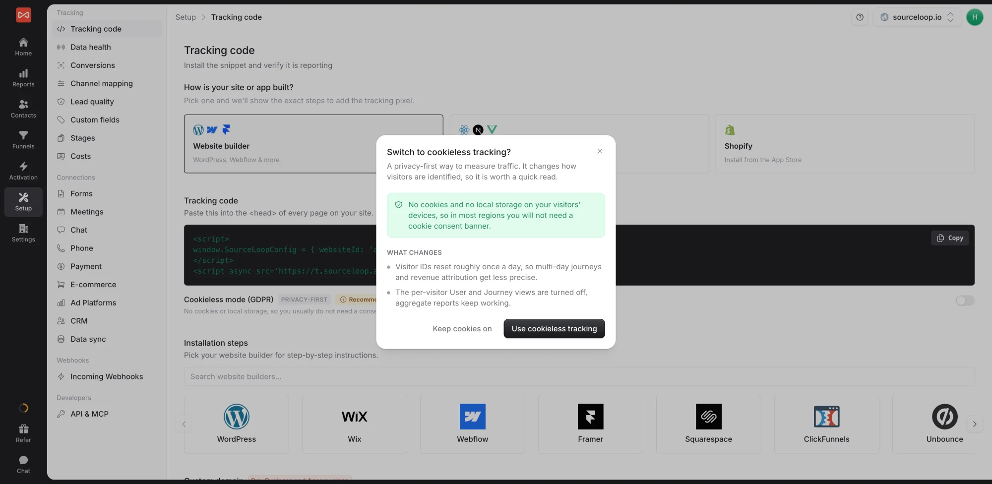 SourceLoop Tracking code page with the Switch to cookieless tracking dialog, explaining that no cookies or local storage are used, visitor IDs reset roughly once a day, and per-visitor user and journey views are turned off